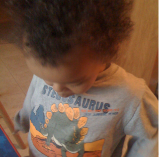 Amani and his dinosaur shirt